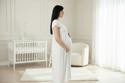 White maternity nightdress by Mini Plum – short-sleeve bump-friendly fit, side view