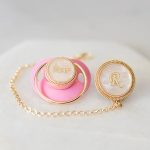 baby pacifer pink gold 